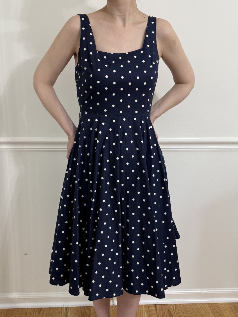 Navy and white sleeveless polka dot midi dress